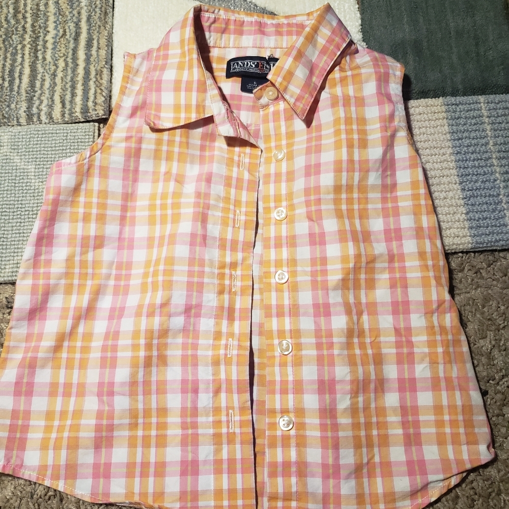 Sleeveless button up.